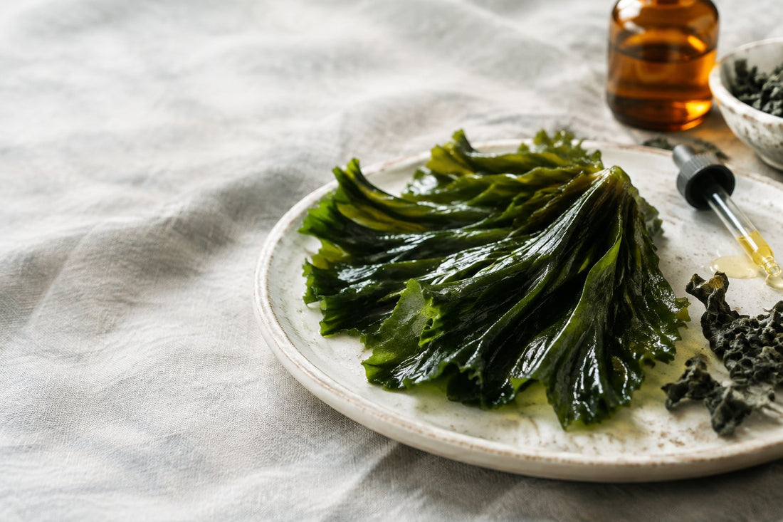 Amber body oil bottle with wakame seaweed, brazil nuts and a passionflower, for wakame skin benefits